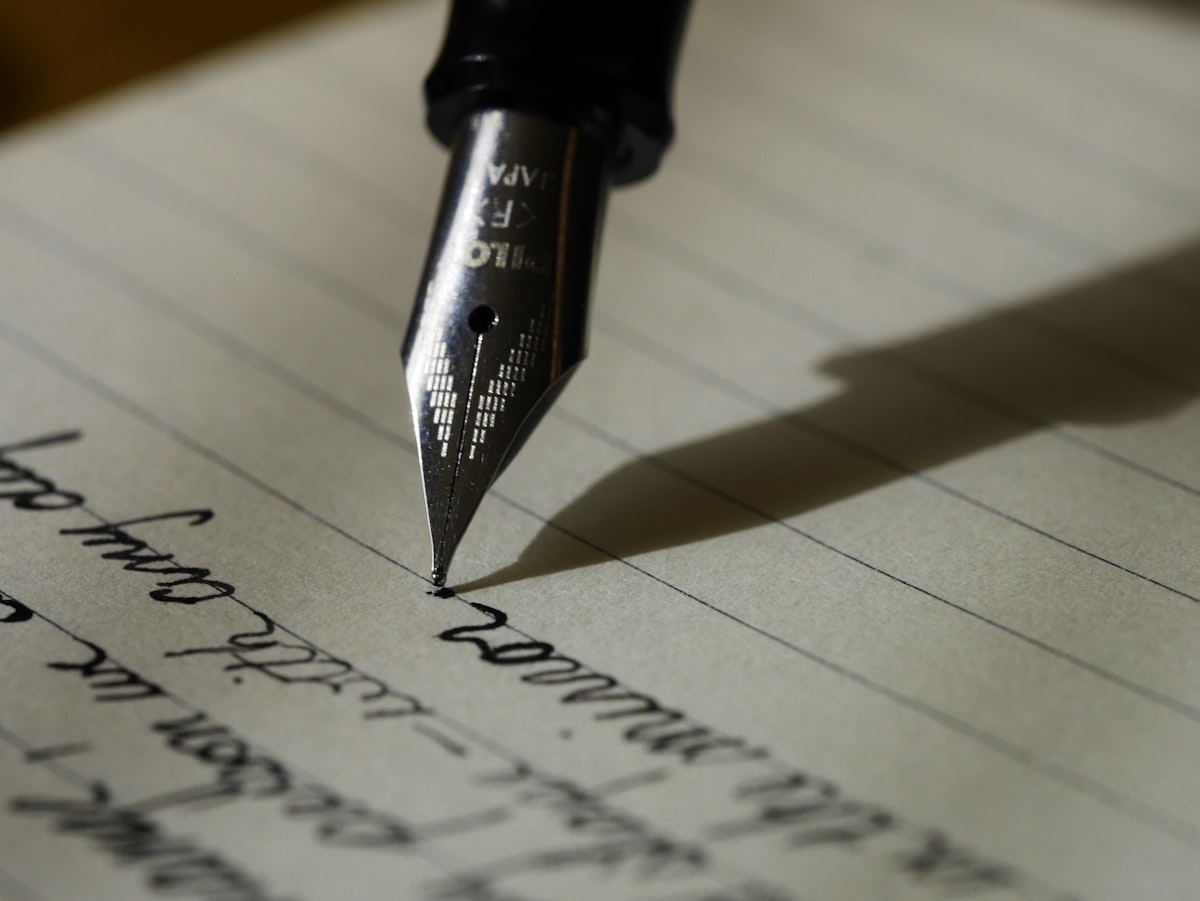 Handwritten note on a desk — human craft in an AI era